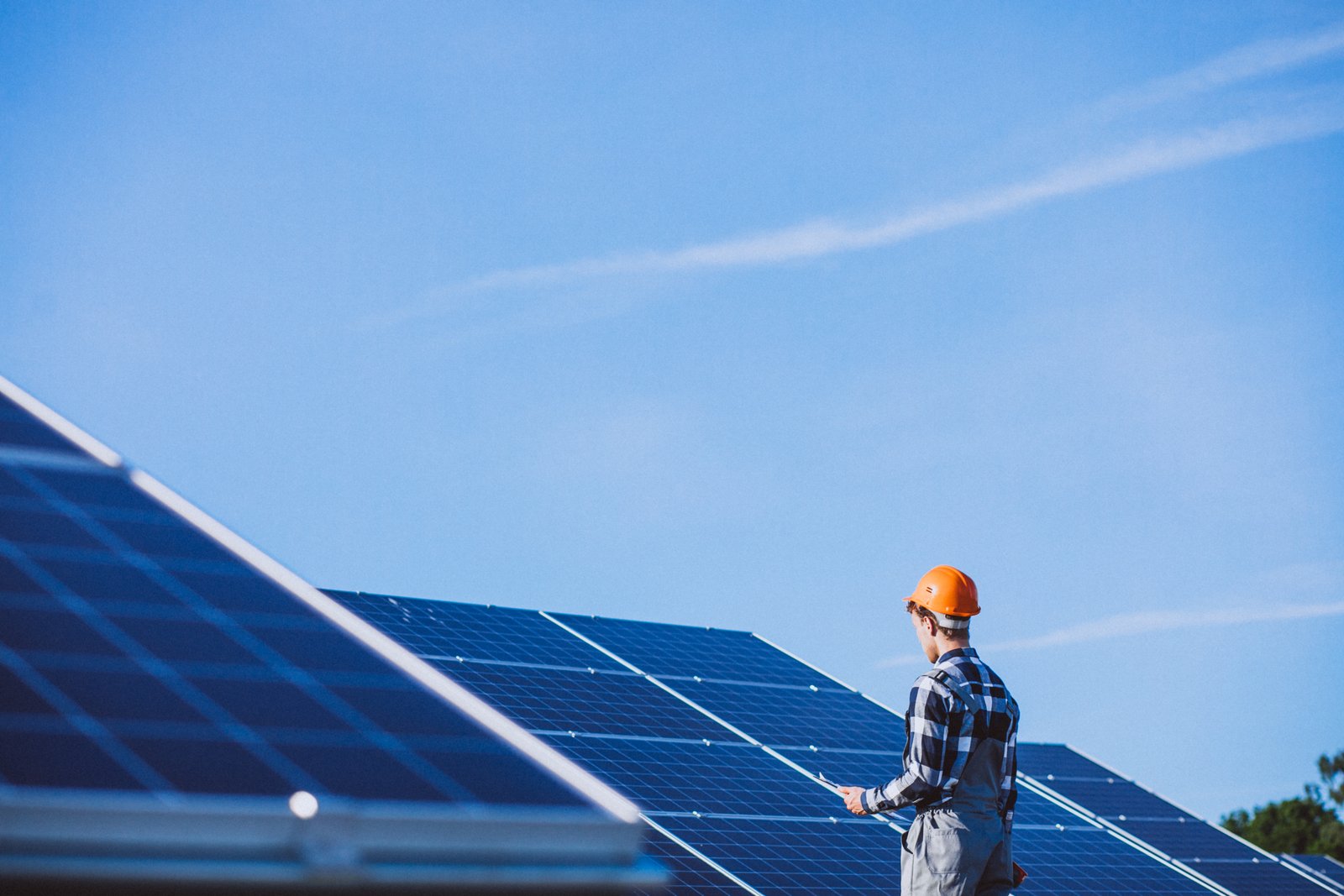 Solar panels beneath a bright sky